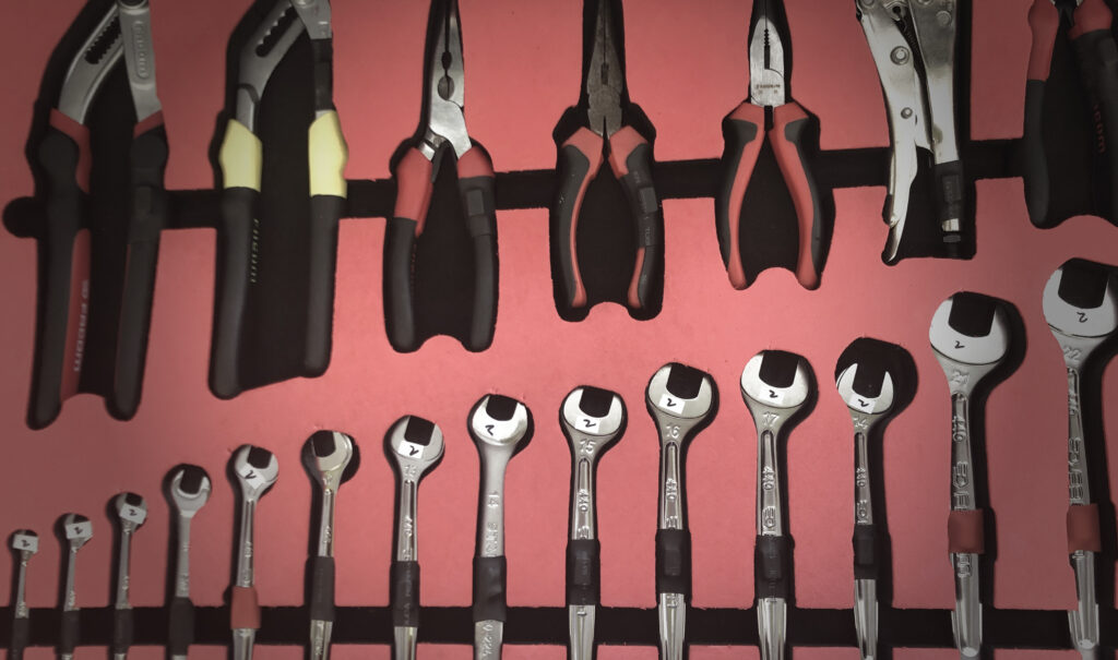 Different tools on a red board